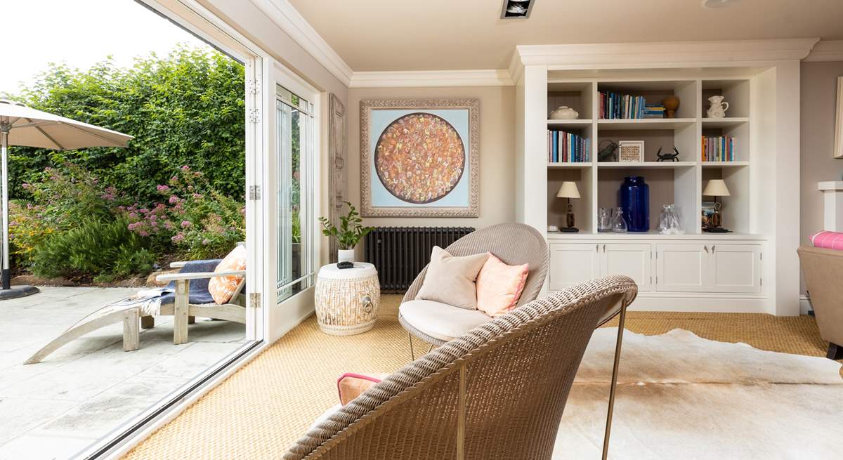 In summer open up the living space and let the outside in, what an amazing space to socialise with family and friends.