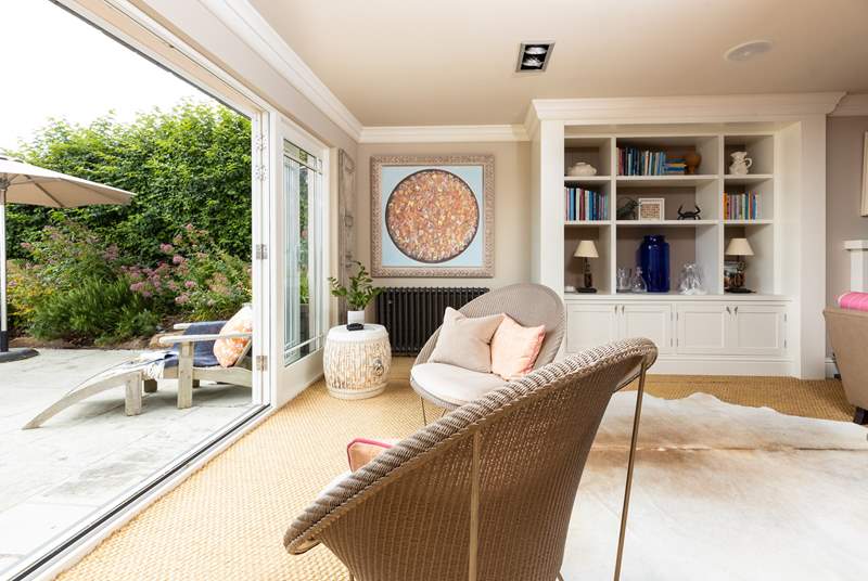In summer open up the living space and let the outside in, what an amazing space to socialise with family and friends.