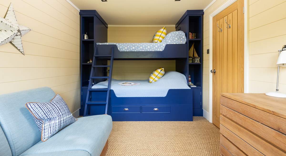 The bunk room has a four-foot bottom bunk so can accommodate two small children. Please note the single top bunk is not to be used by guests.