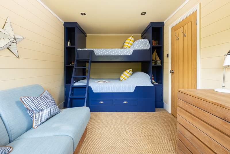 The bunk room has a four-foot bottom bunk so can accommodate two small children. Please note the single top bunk is not to be used by guests.