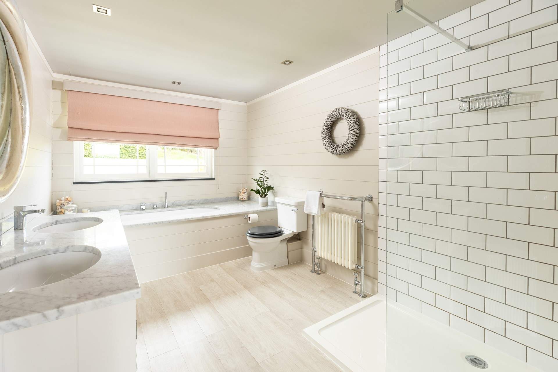 The fabulous en suite bathroom to bedroom 1 has a gorgeous bath, large shower and double sinks.