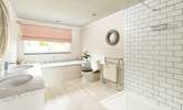 The fabulous en suite bathroom to bedroom 1 has a gorgeous bath, large shower and double sinks. - Thumbnail Image