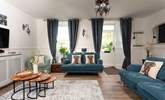 Discover the restful sitting-room you can easily imagine yourself unwinding here after a day exploring this special slice of Cornwall. - Thumbnail Image