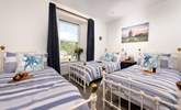 Bedroom 3 has three single beds perfect for our younger guests who would like to have a holiday sleepover, maybe with a midnight feast too. - Thumbnail Image