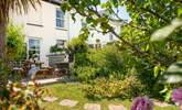 The garden is a fabulous spot for sun-soaked dining, with a cute terrace area with table and chairs, perfect for those sunny lunches and Cornish cream teas. (Please note, the chiminea and barbecue have been replaced with a portable fire-pit/barbecue). - Thumbnail Image