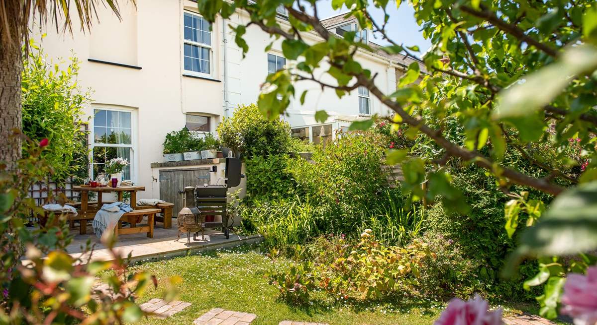 The garden is a fabulous spot for sun-soaked dining, with a cute terrace area with table and chairs, perfect for those sunny lunches and Cornish cream teas. (Please note, the chiminea and barbecue have been replaced with a portable fire-pit/barbecue).