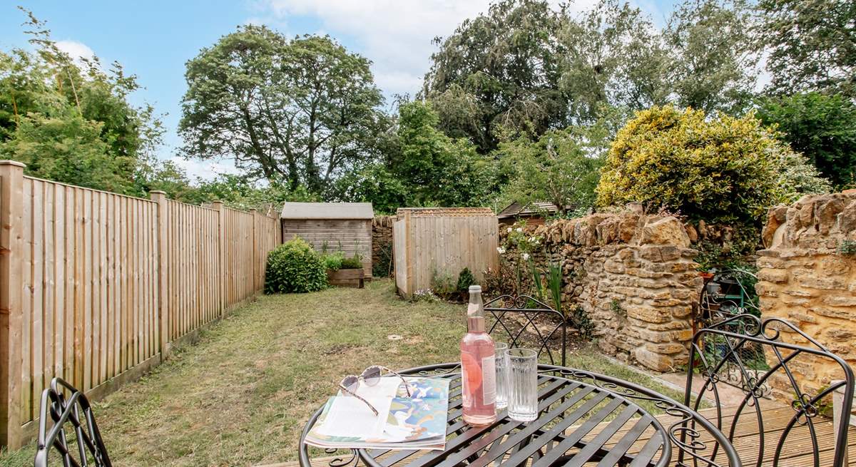 Take a chair in the garden for a moment to catch up on some reading.