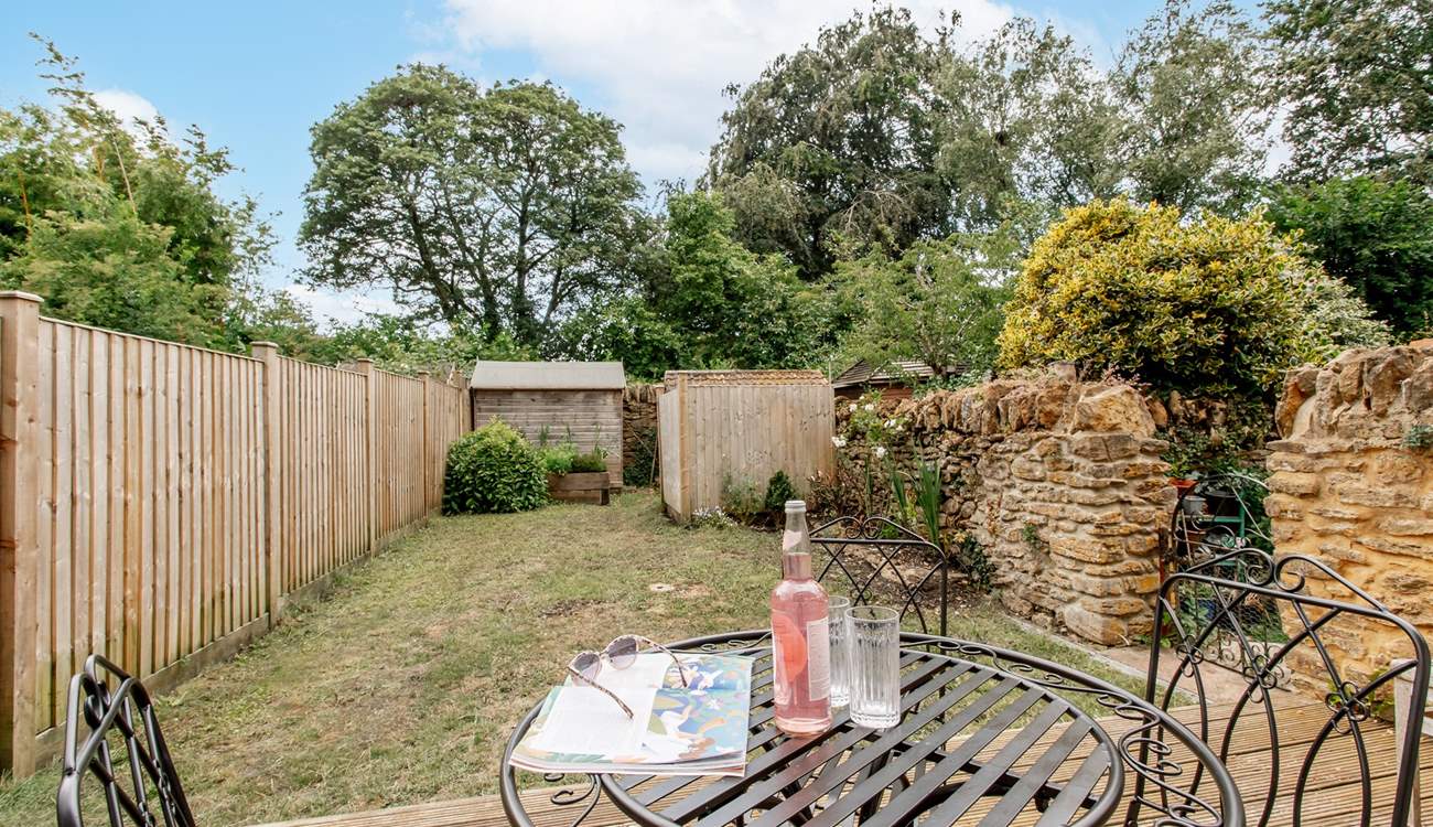 Take a chair in the garden for a moment to catch up on some reading.