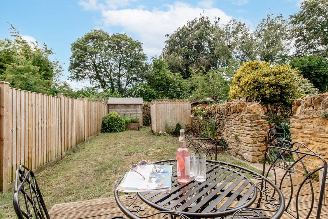 Take a chair in the garden for a moment to catch up on some reading.