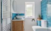 The family bathroom is bright and modern. - Thumbnail Image