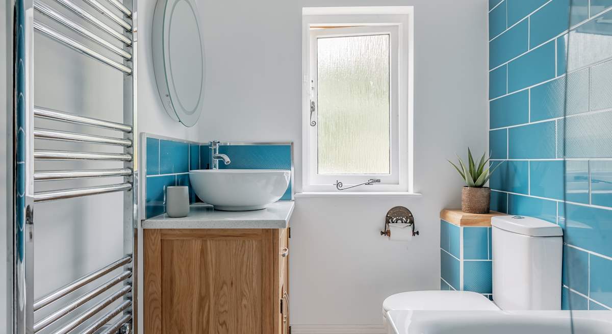 The family bathroom is bright and modern.