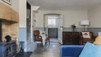 The sitting-room is at the heart of this delightful cottage.