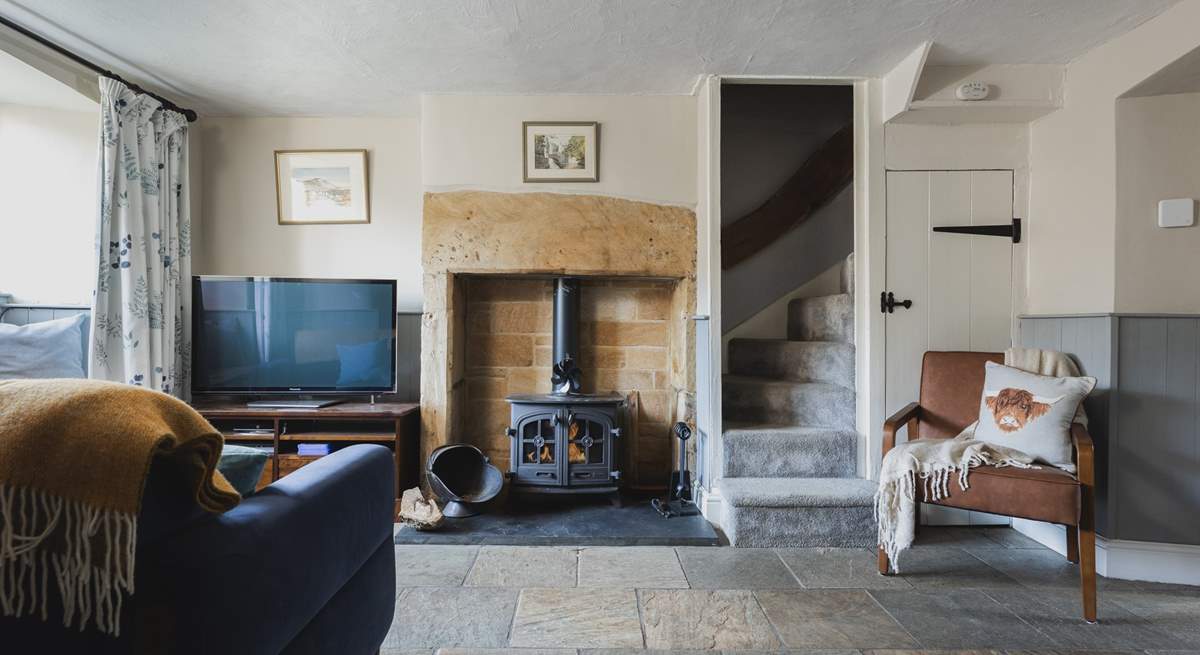 The roaring wood-burner and feature fireplace is a delight.