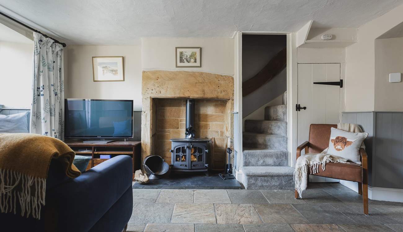 The roaring wood-burner and feature fireplace is a delight.