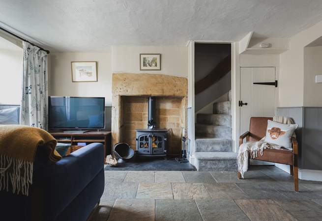 The roaring wood-burner and feature fireplace is a delight.