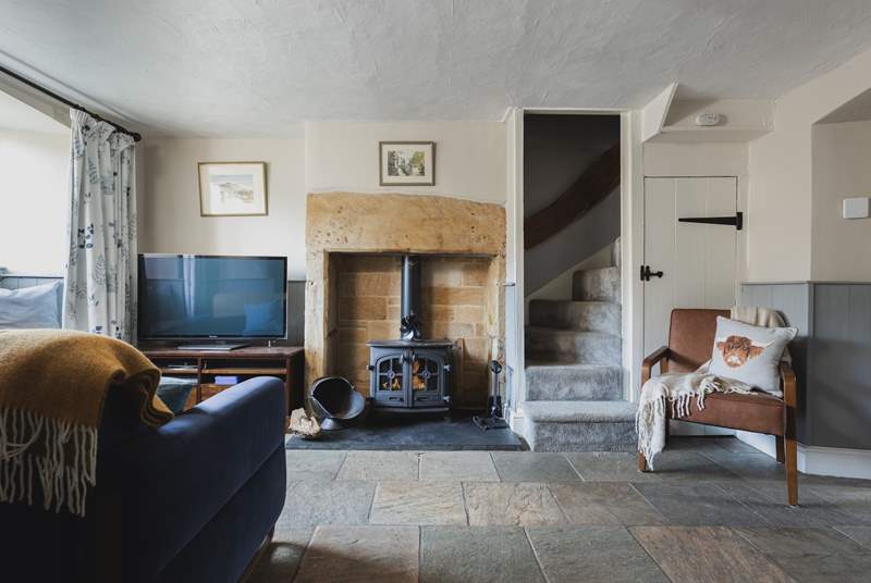 The roaring wood-burner and feature fireplace is a delight.