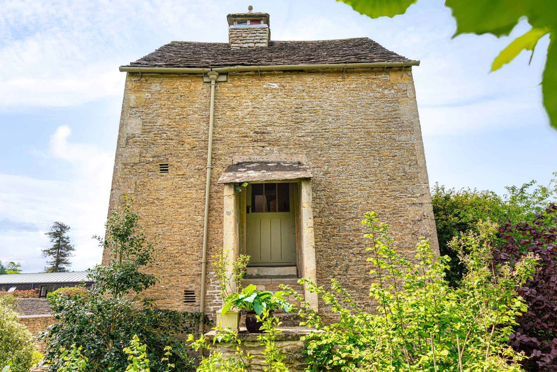 Original features can still be enjoyed like this charming old doorway and stone steps.