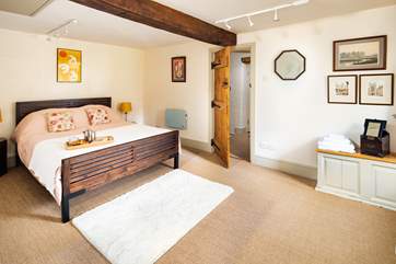 The bedroom leads out to the upstairs shower-room.
