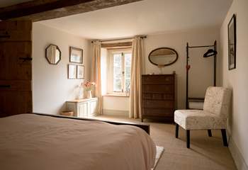 The bedroom is styled to perfection with plenty of storage