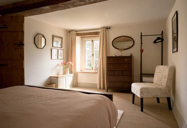 The bedroom is styled to perfection with plenty of storage