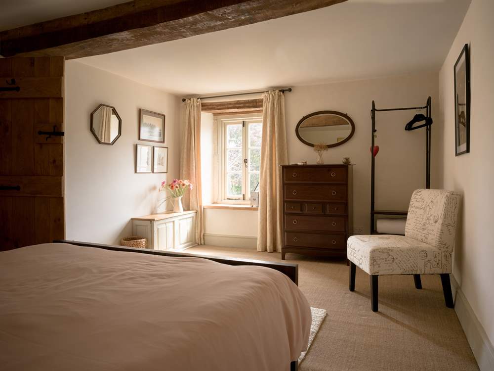 The bedroom is styled to perfection with plenty of storage