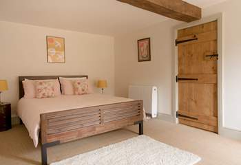 The bedroom is a peaceful space and overlooks the garden