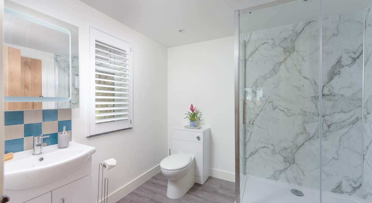 The contemporary family shower-room located on the ground floor.