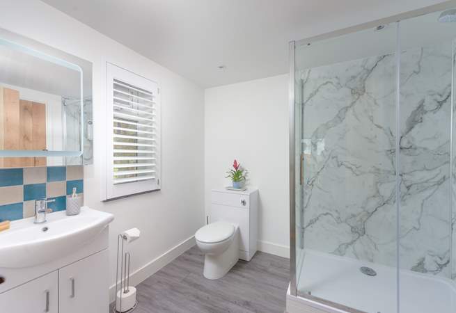 The contemporary family shower-room located on the ground floor.