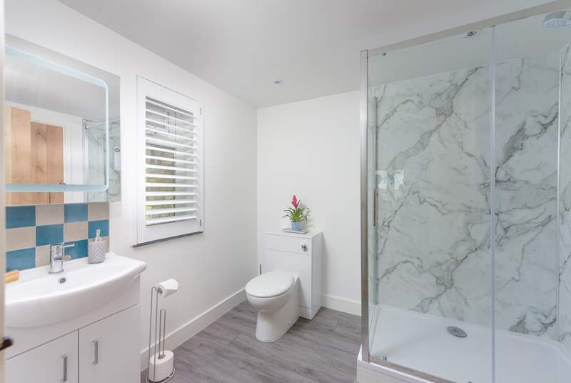 The contemporary family shower-room located on the ground floor.