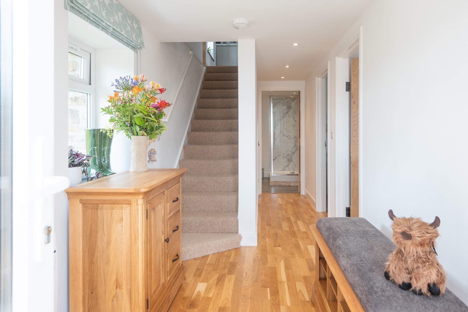 The lovely entrance hall. Stairs lead up to the open plan living area. 