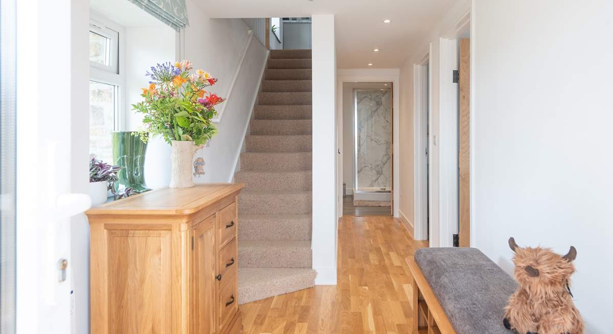 The lovely entrance hall. Stairs lead up to the open plan living area. 