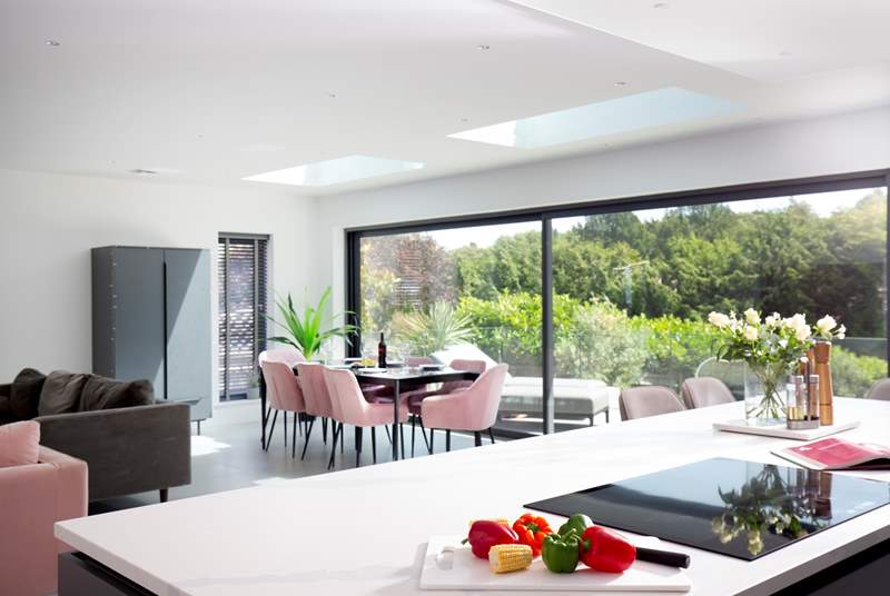 The open plan living area is light and spacious with bi-folding doors opening to the patio and garden.