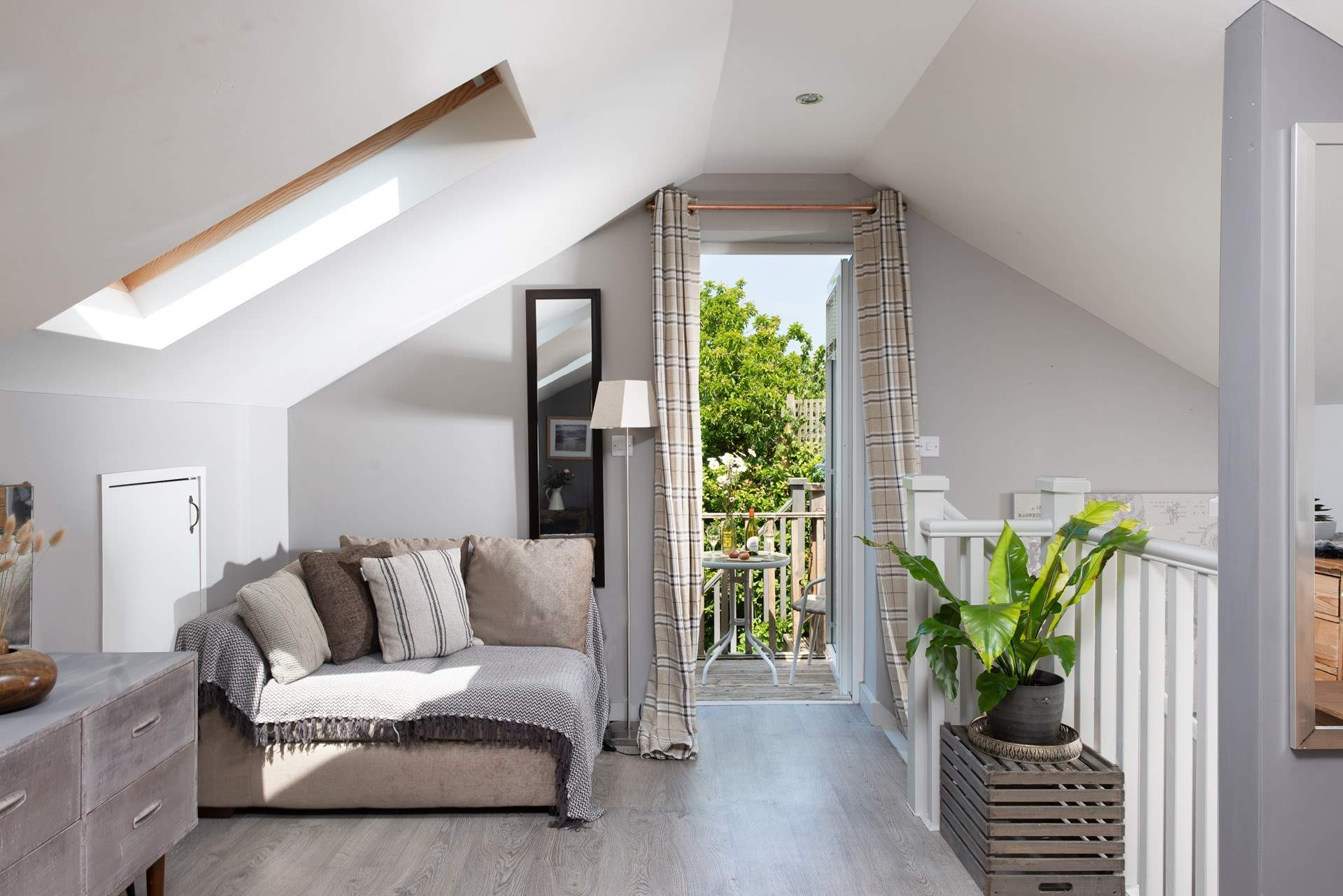 Open up the bedroom doors and walk out onto the decked balcony. 