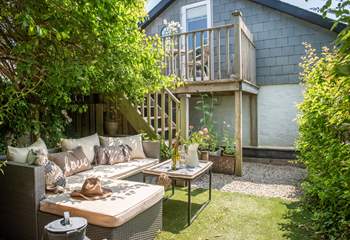 From the deck take the steps down to a secluded garden where you will find a table and sofa. We think this is the perfect spot for an intimate al fresco supper for two.