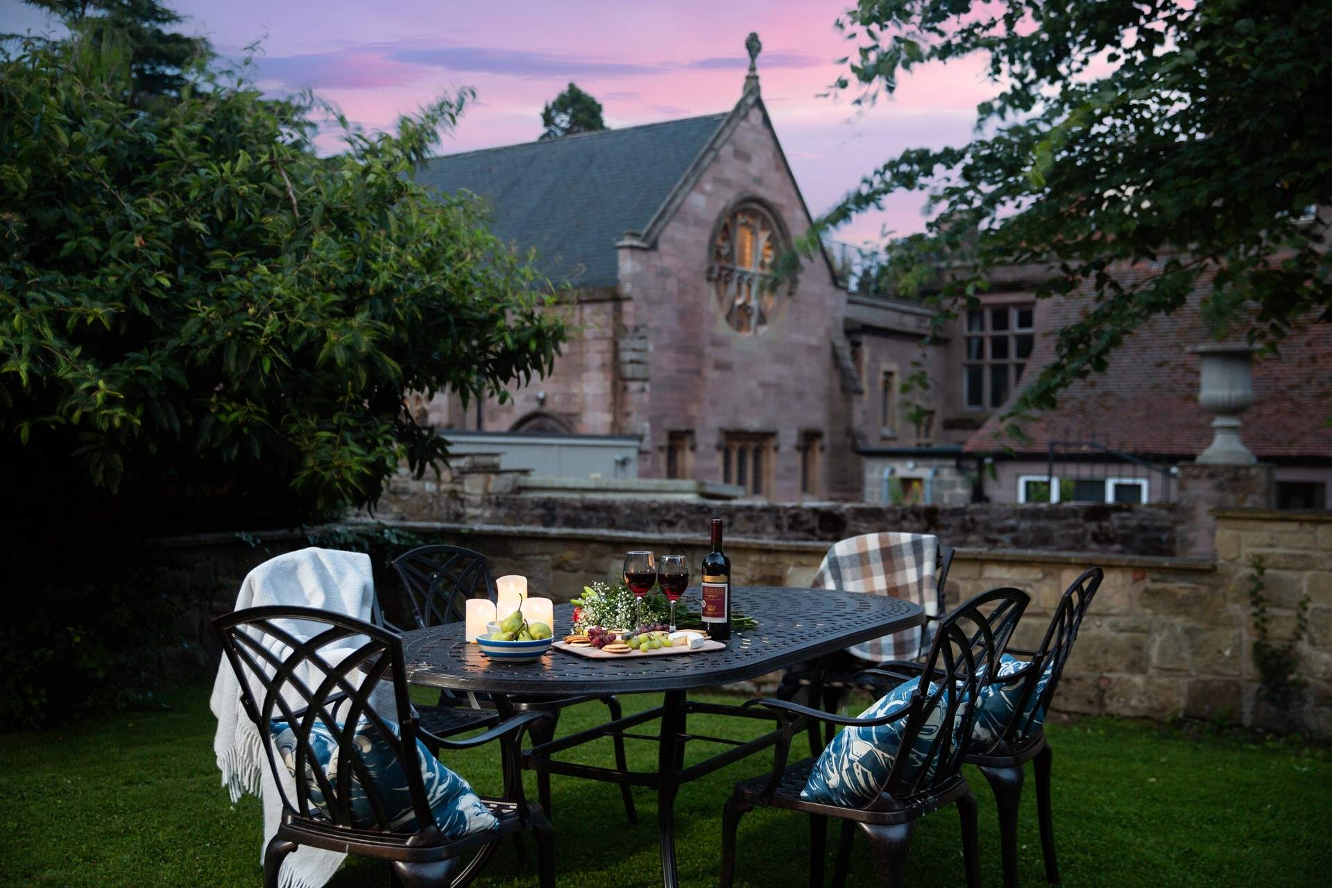 Enjoy a glass of wine and listen to the peacocks calling.