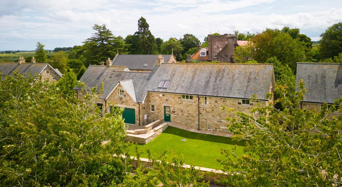 Keepers Cottage is nestled in the beautiful green countryside with Ellingham Hall, a popular wedding venue, in the background.