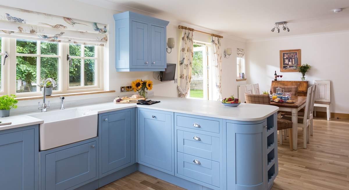 This fantastic country kitchen has plenty of space for preparing a meal.