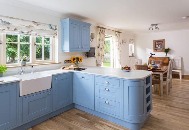 This fantastic country kitchen has plenty of space for preparing a meal.