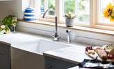 The Belfast sink lends a country feel to the kitchen. - Thumbnail Image