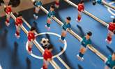 Challenge each other to a table football tournament. - Thumbnail Image