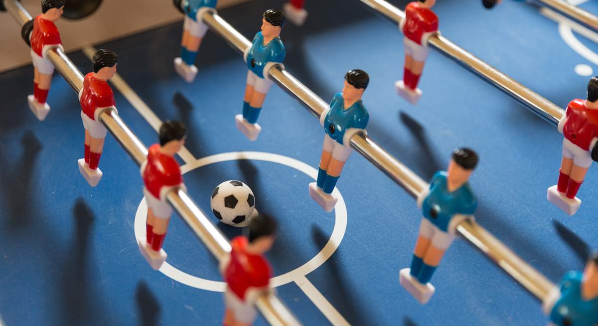 Challenge each other to a table football tournament.