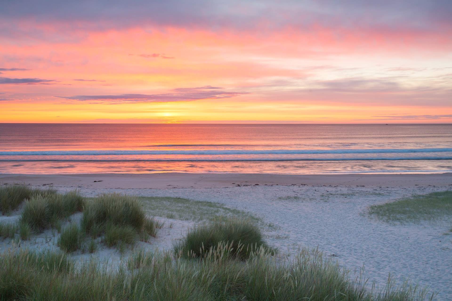 The best place to enjoy the sunrise is on the nearby beach.