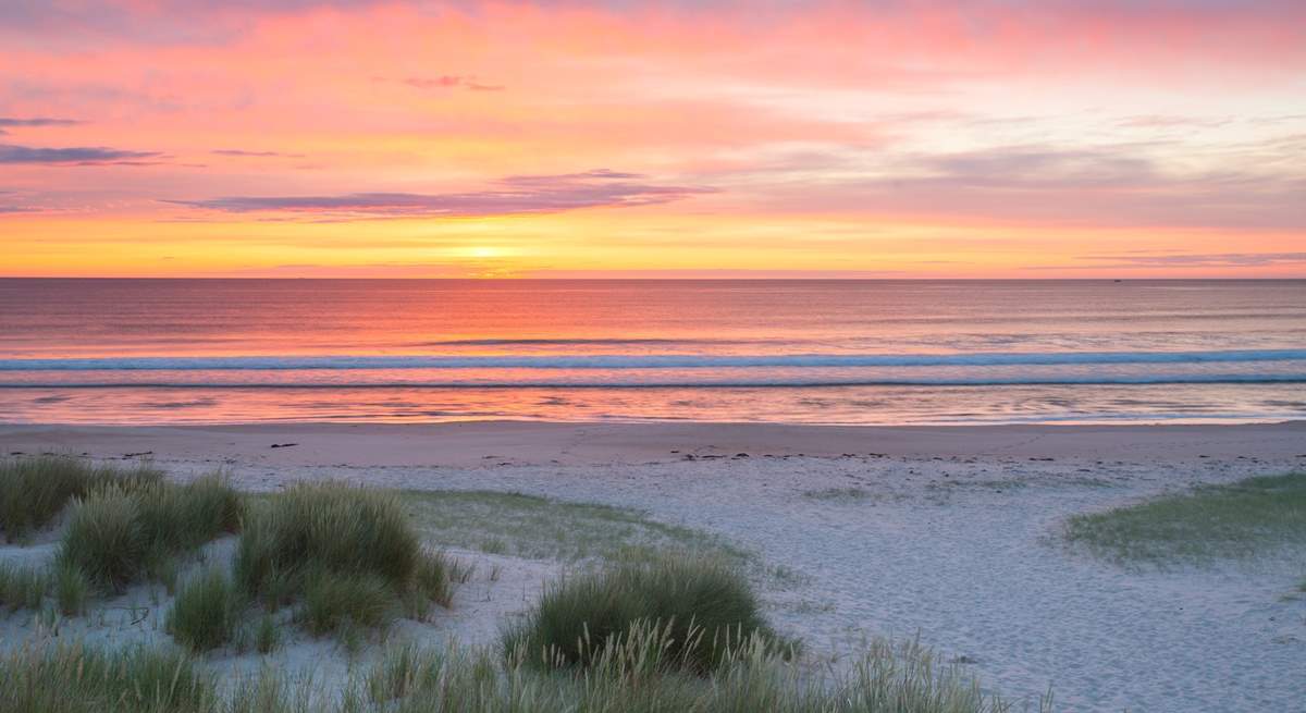 The best place to enjoy the sunrise is on the nearby beach.