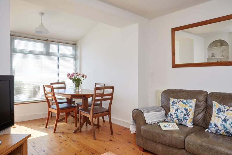 The open plan sitting room also features dining space, somewhere to sit and plan your daily activities over breakfast.