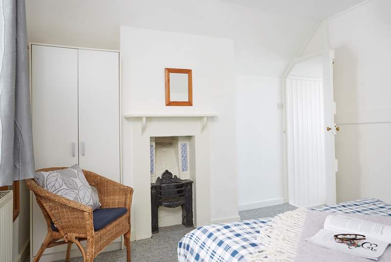 The double bedroom has a handy en suite and traditional features. 