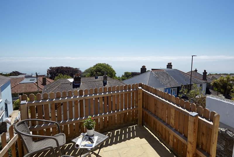 The bijou sun terrace at the front of the property,  take a seat here for views across the rooftops to the English Channel beyond.