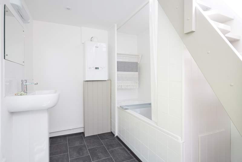 The first floor bathroom with steps leading up to the roof terrace.