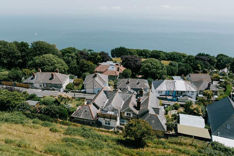 A bird's eye view of the cottage from Ventnor Downs, with the little roof terrace located at the back of the house.