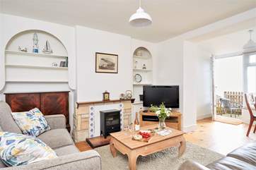 The sitting-room offers some homely comforts after a busy day on the beach.