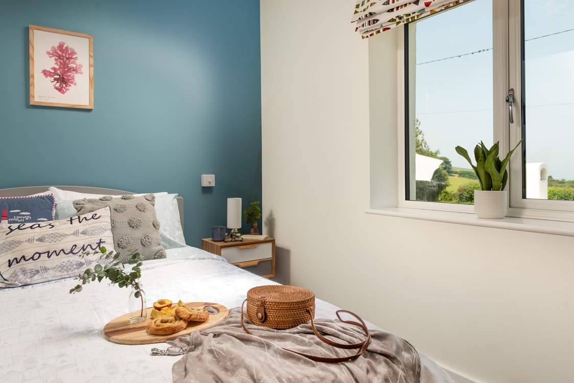 Bedroom one has wonderfully far reaching views out to sea.